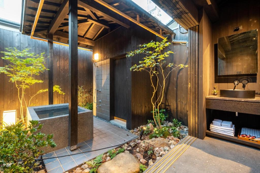 a bathroom with a sink and a tub at Manyoukyo - Vacation STAY 92449 in Kyoto