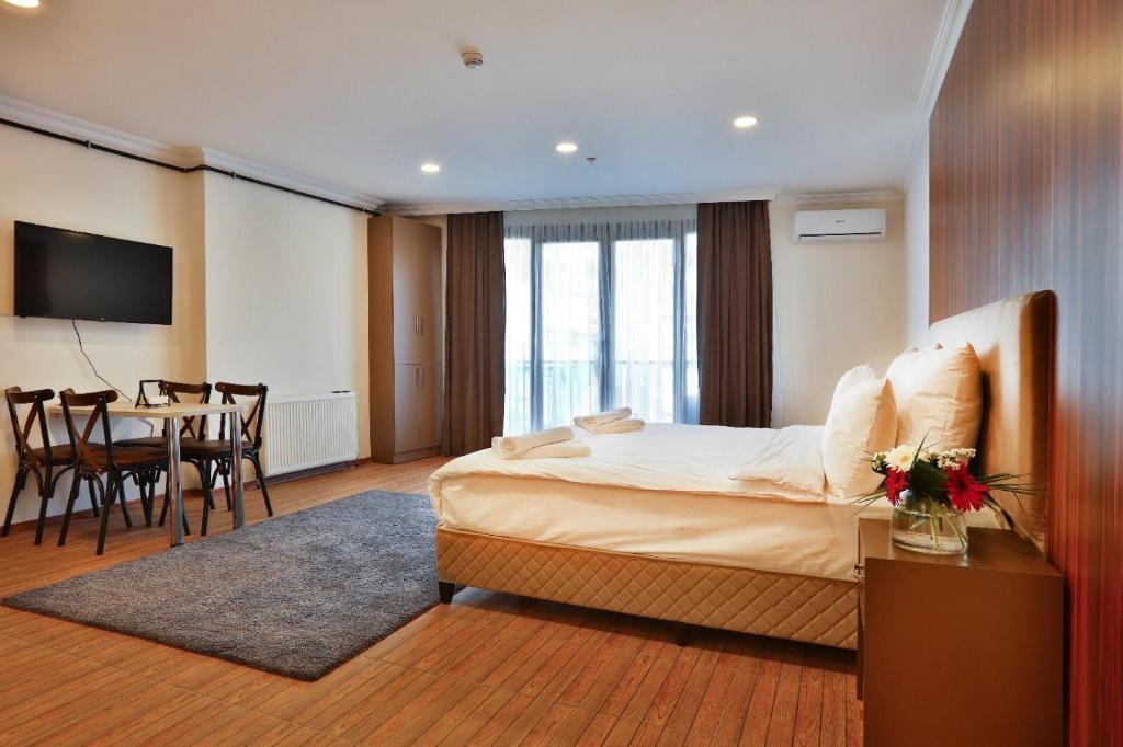 Postel nebo postele na pokoji v ubytování Modern Suites