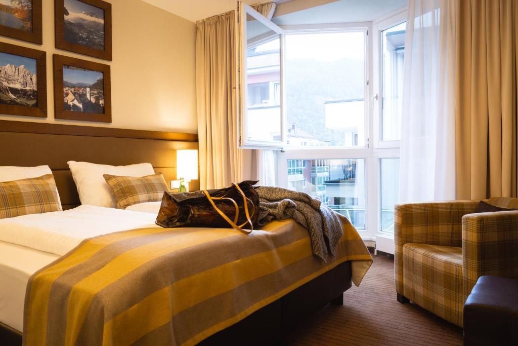 Postel nebo postele na pokoji v ubytování Hotel Stadt Kufstein