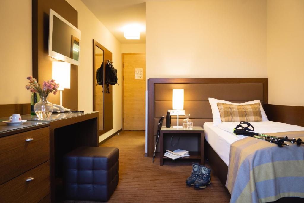 Cama ou camas em um quarto em Hotel Stadt Kufstein