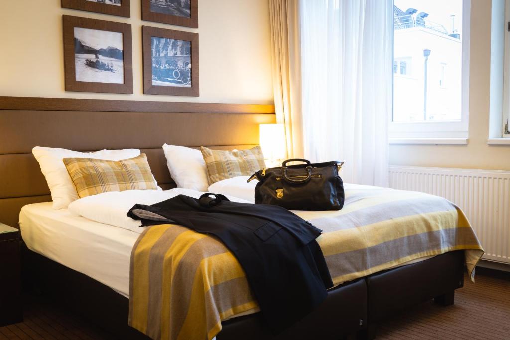 Cama ou camas em um quarto em Hotel Stadt Kufstein
