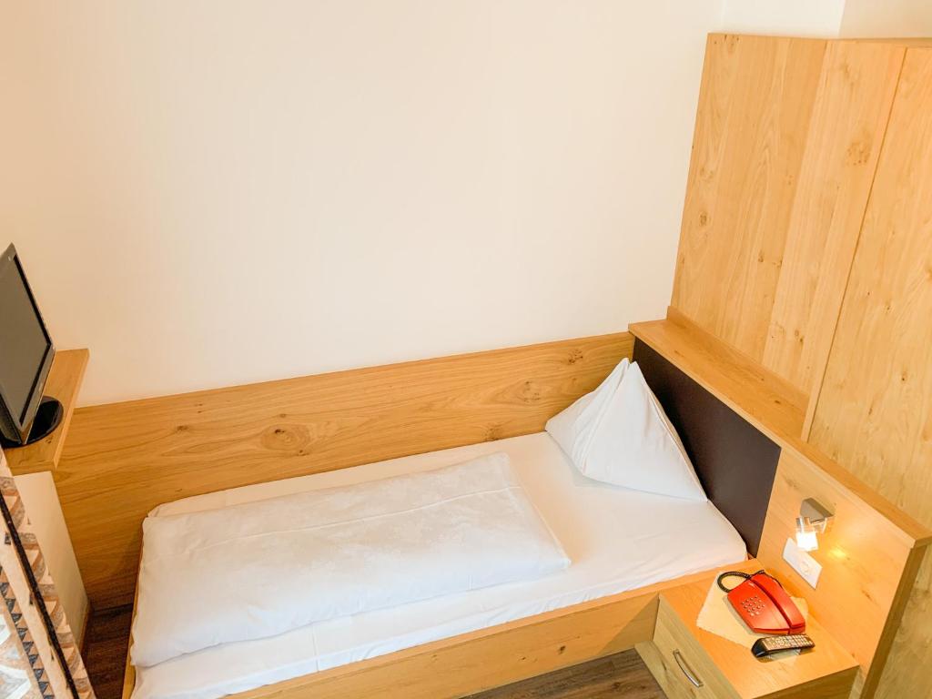 Postel nebo postele na pokoji v ubytování Hotel Montani