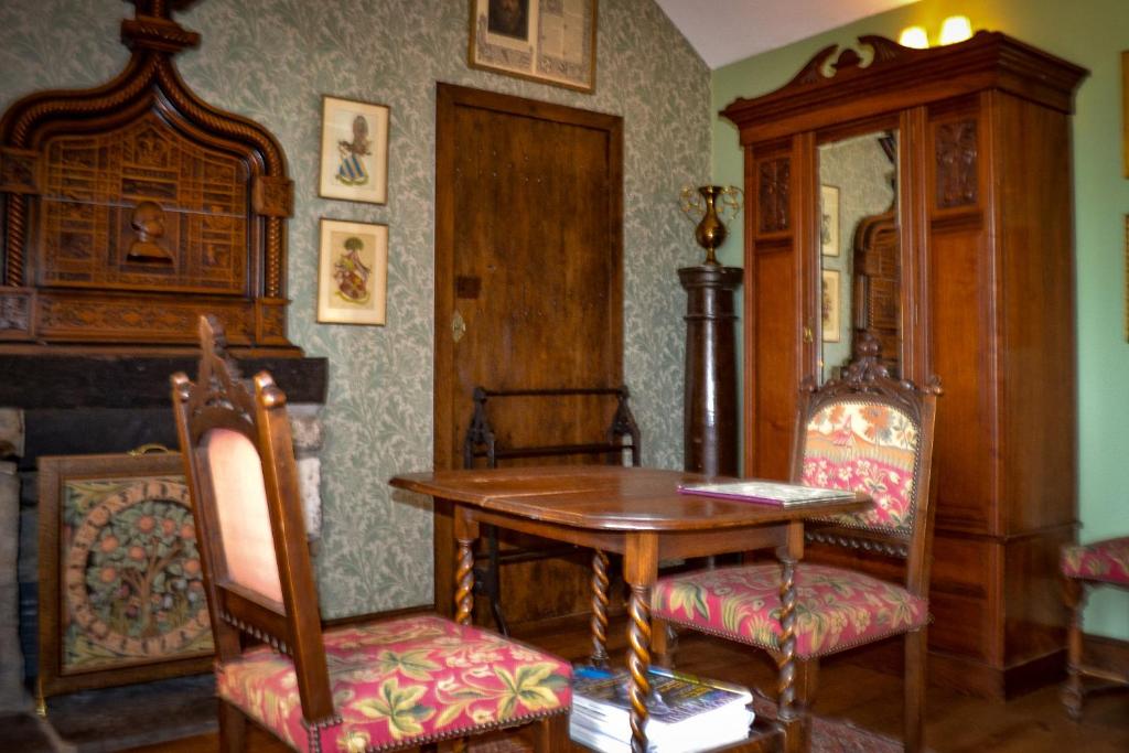 a dining room with a table and two chairs at The Lady Maxwell Room at Buittle Castle in Dalbeattie