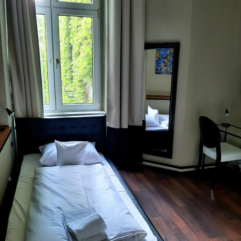 Postel nebo postele na pokoji v ubytování ArtHotel Connection
