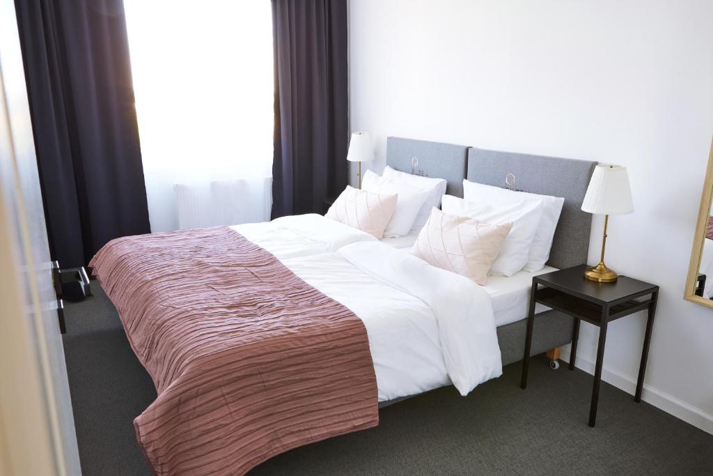 Posteľ alebo postele v izbe v ubytovaní Silesia Apartments