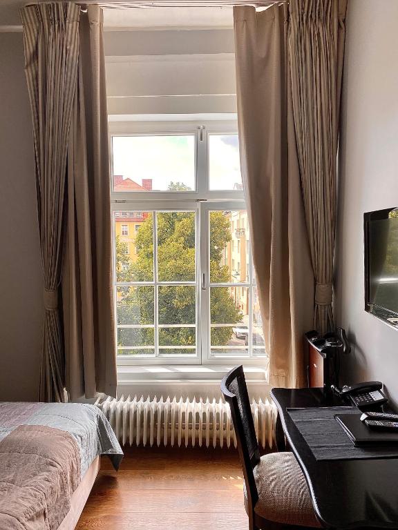 Postel nebo postele na pokoji v ubytování Das Nikolai Hotel