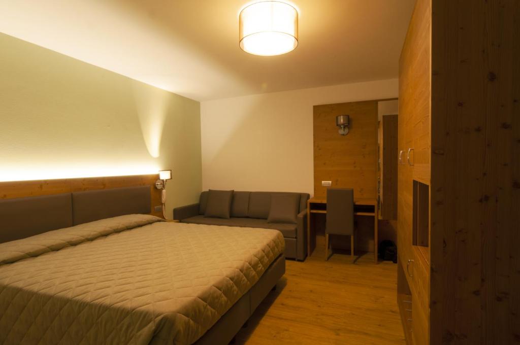 Postel nebo postele na pokoji v ubytování Albergo Antelao