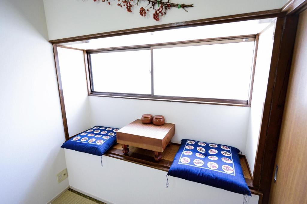 Cama o camas de una habitación en 林林の民宿-NISHIKUJIO 別館
