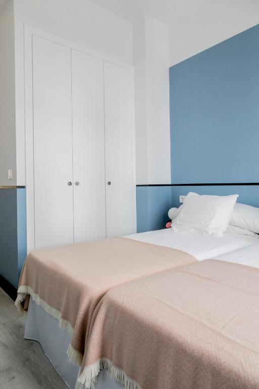 Postel nebo postele na pokoji v ubytování Pasaje Zamora Apartamentos
