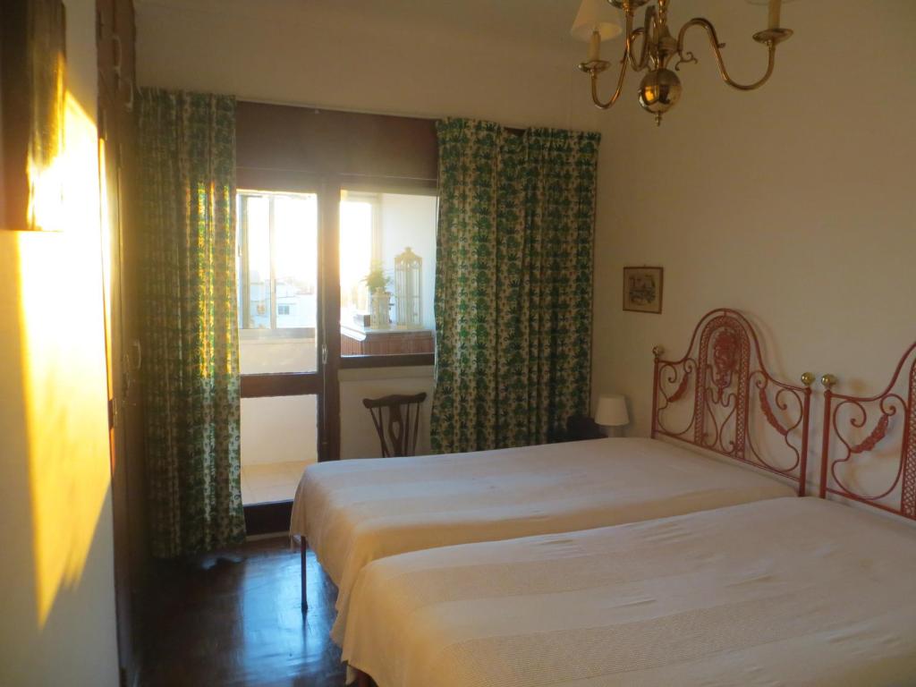 Ένα ή περισσότερα κρεβάτια σε δωμάτιο στο Caparica for Rent