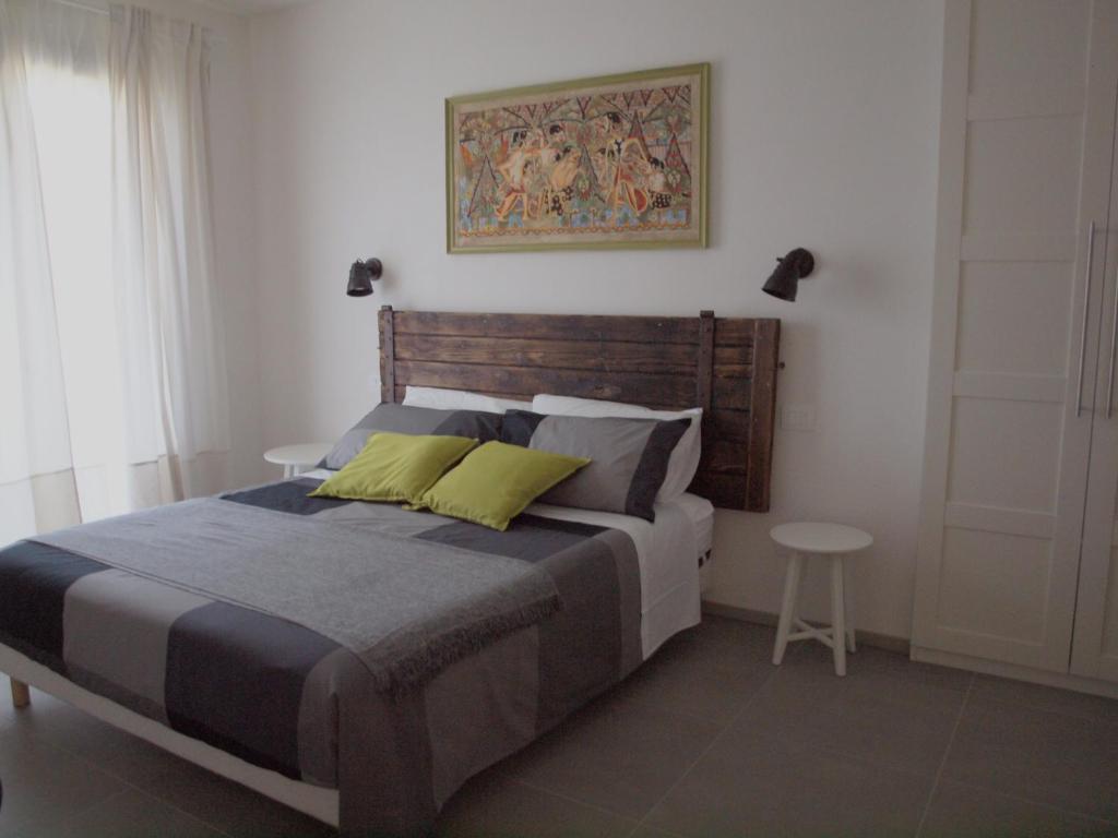 a bedroom with a large bed and a table at B&B Ramerino in Grosseto