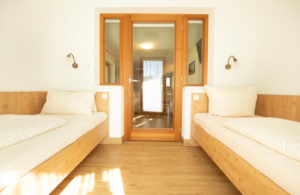 Posteľ alebo postele v izbe v ubytovaní Alpchalet Tirol