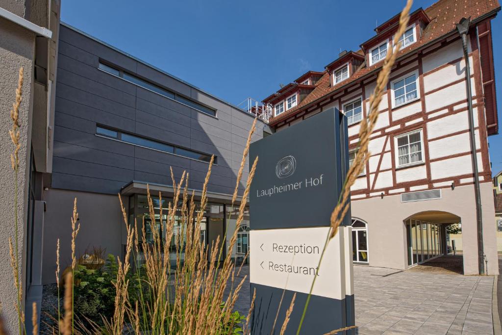 a sign in front of a building at AKZENT Hotel Laupheimer Hof in Laupheim