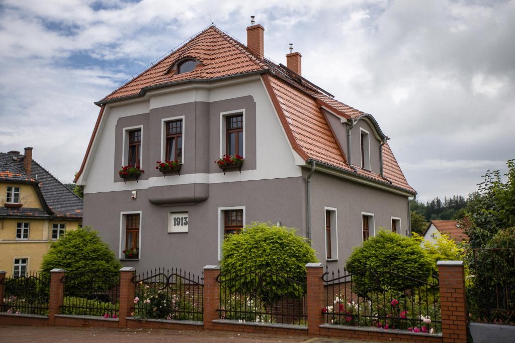 a white house with a red roof at Villa 1913 in Kamienna Góra