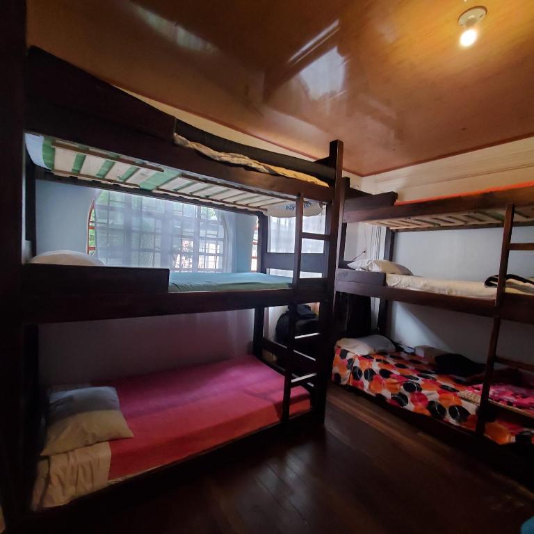 Postel nebo postele na pokoji v ubytování Hostal CQ Chapinero