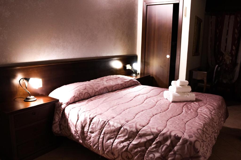 Postel nebo postele na pokoji v ubytování Agriturismo Aria Fina