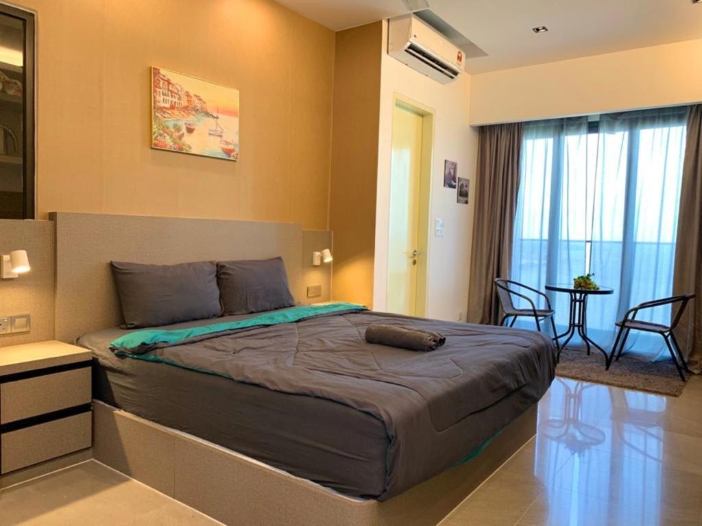 a bedroom with a large bed in a room at Imperio,Res - Stylish -- Magnificent -- Seaview in Malacca
