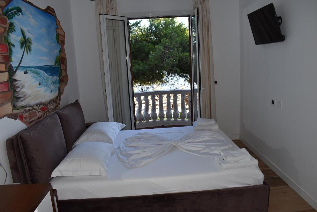Postel nebo postele na pokoji v ubytování COSMO Beach Hotel