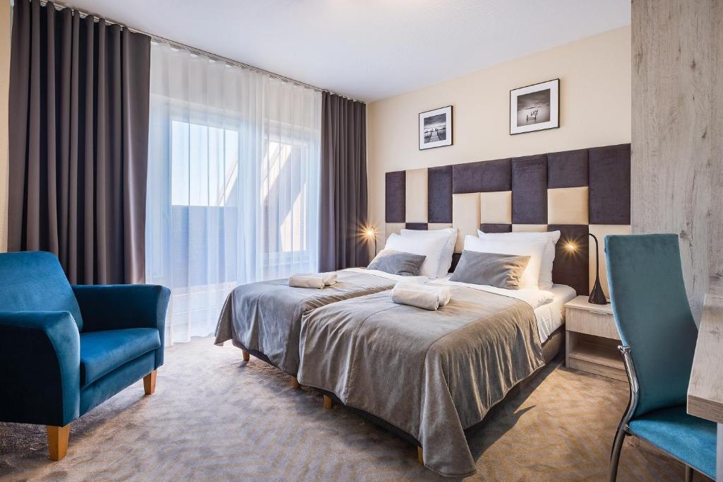 Postel nebo postele na pokoji v ubytování Max Health Resort SPA