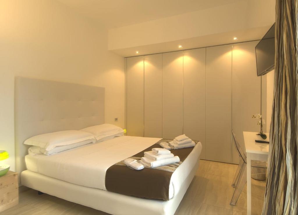 Posteľ alebo postele v izbe v ubytovaní Residenza Ginepri 69