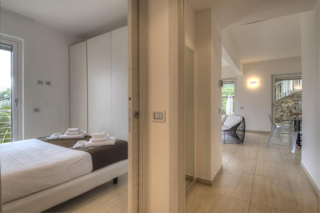 Posteľ alebo postele v izbe v ubytovaní Residenza Ginepri 69
