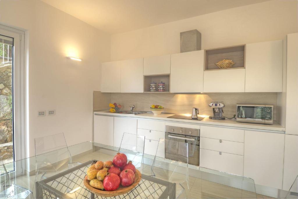 Kuchyňa alebo kuchynka v ubytovaní Residenza Ginepri 69