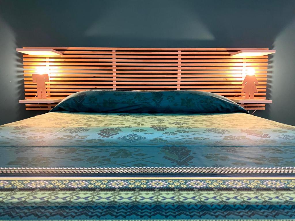 Łóżko lub łóżka w pokoju w obiekcie casa vacanze Sleep Art