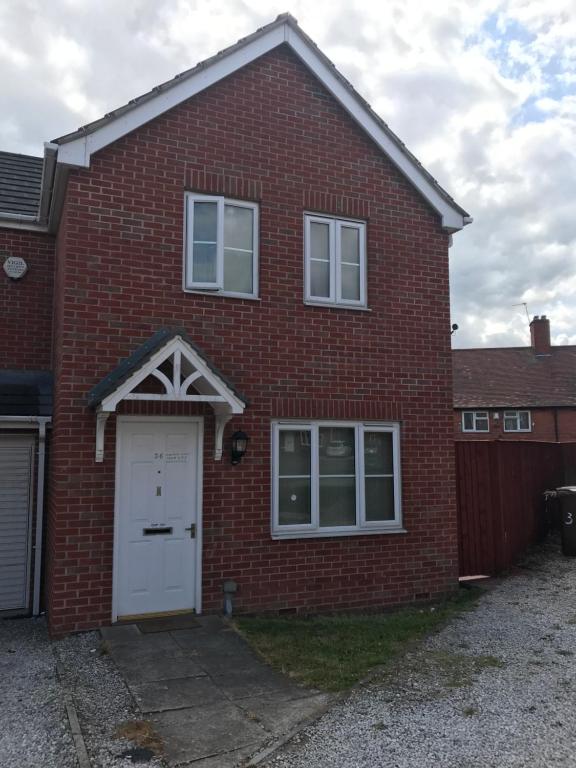 a red brick house with a white door at WHOLE HOUSE 3bedroom New Build 36 Nottingham in Nottingham