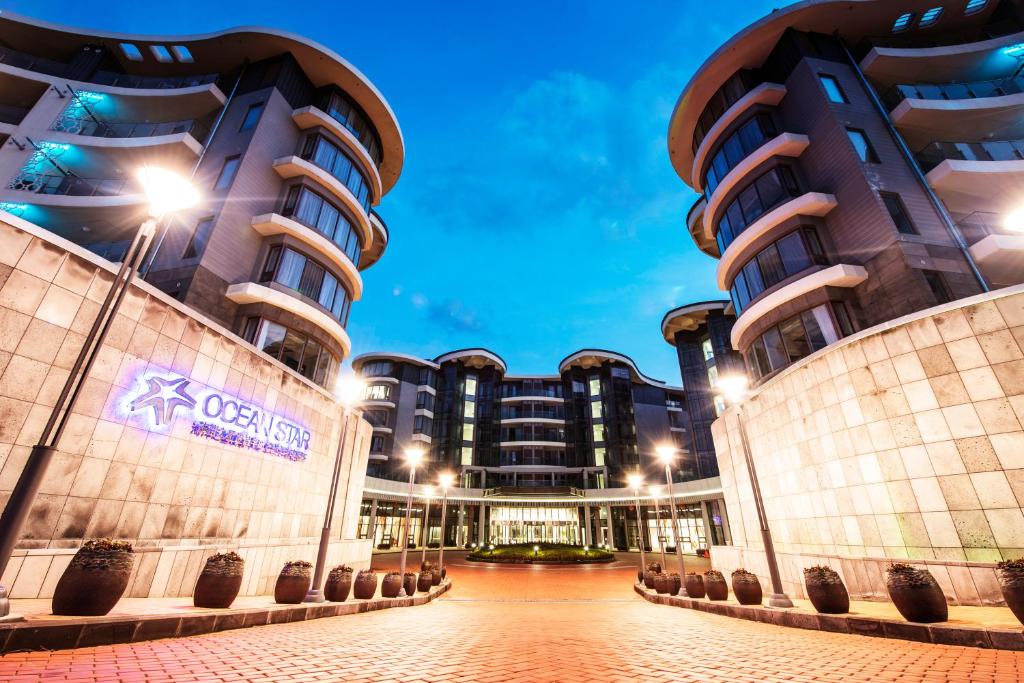 a view of a building at night at Ocean Star Condominium in Seogwipo