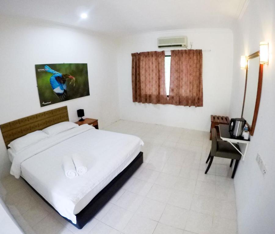 Postel nebo postele na pokoji v ubytování Xcape Resort Taman Negara