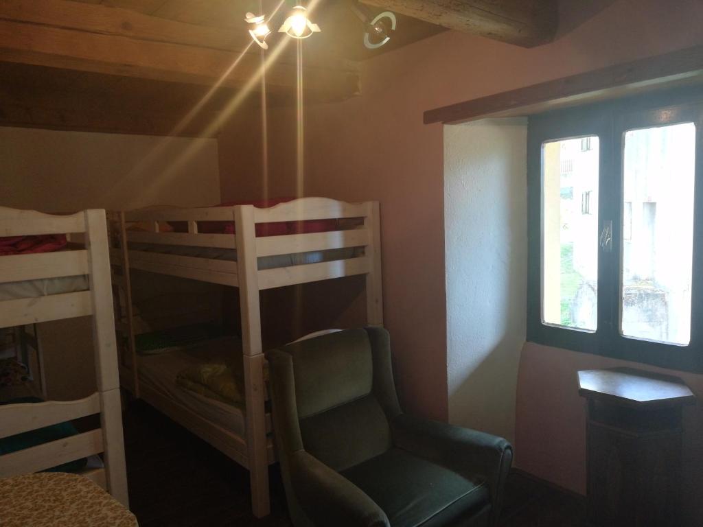 Palanda nebo palandy na pokoji v ubytování Rifugio Monte Zeus