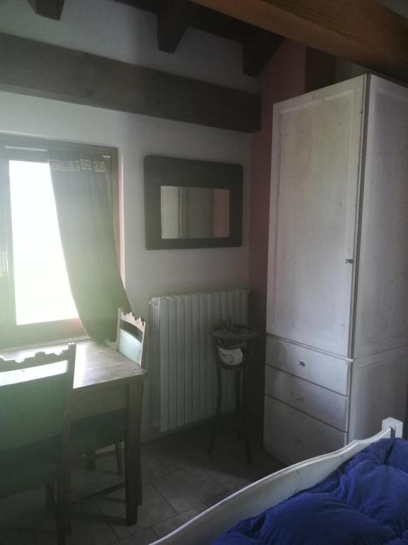 Postel nebo postele na pokoji v ubytování Rifugio Monte Zeus