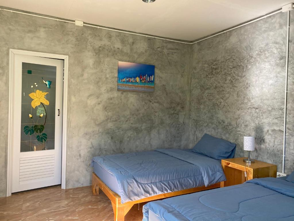 Postel nebo postele na pokoji v ubytování PD Guesthouse