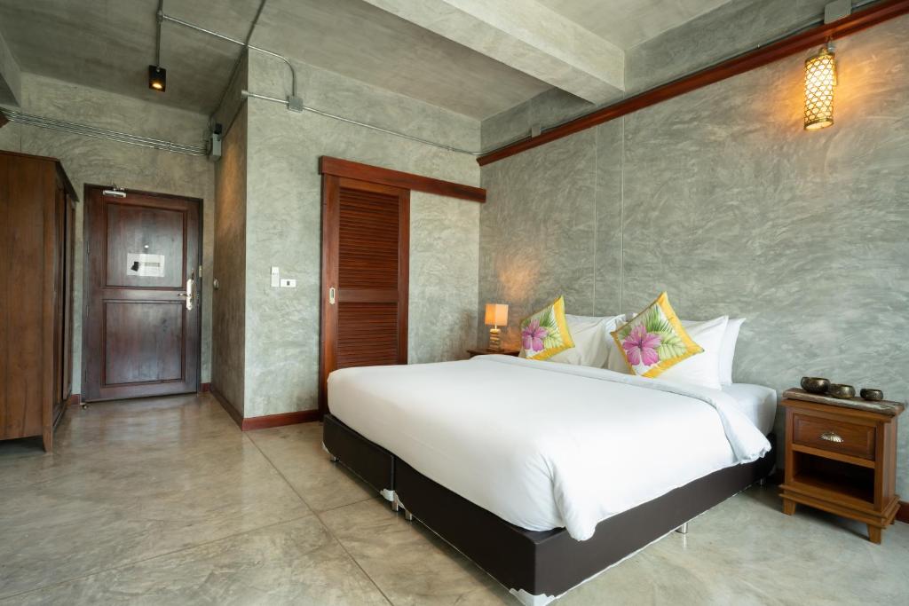 Postel nebo postele na pokoji v ubytování Kasayapi Hotel