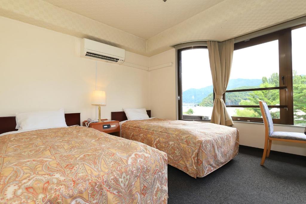 Letto o letti in una camera di Shiki-no-Yado Fujisan
