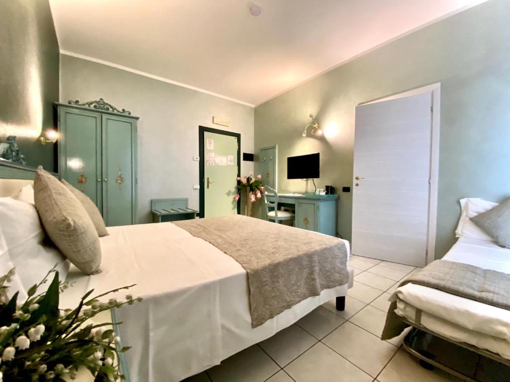 Postel nebo postele na pokoji v ubytování Piccolo Hotel Nogara