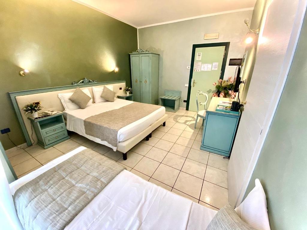 Postel nebo postele na pokoji v ubytování Piccolo Hotel Nogara
