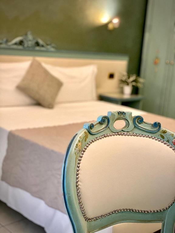 Postel nebo postele na pokoji v ubytování Piccolo Hotel Nogara