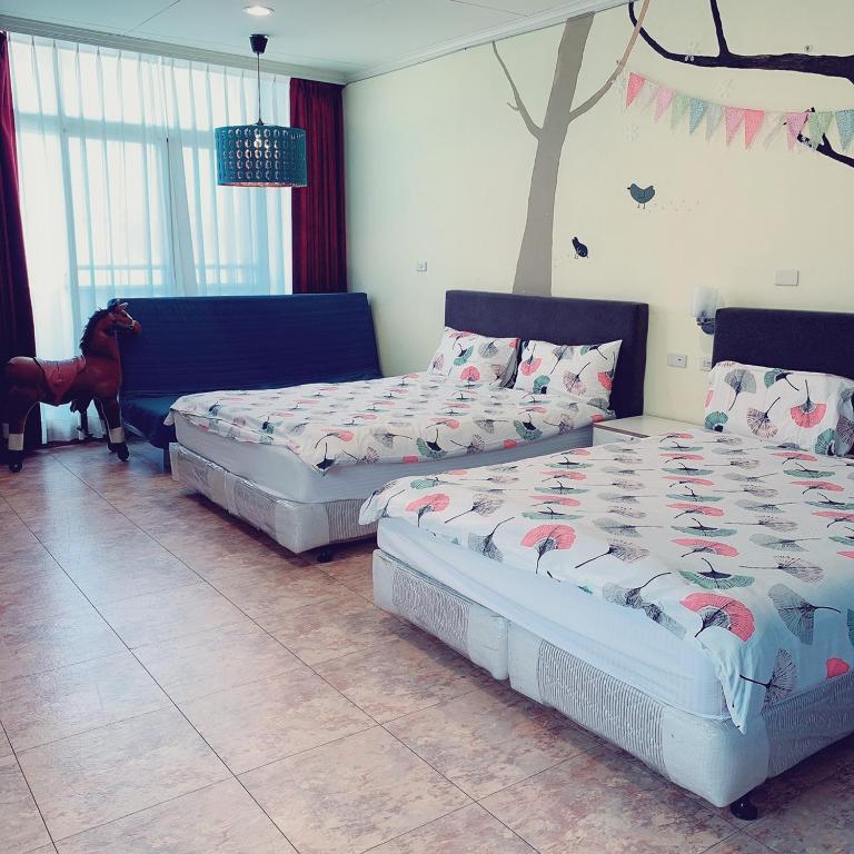 Postel nebo postele na pokoji v ubytování Backstreet Inn