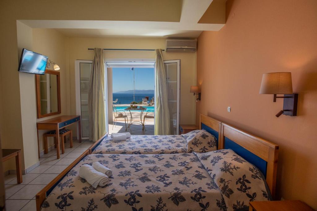 Postel nebo postele na pokoji v ubytování Garbis Villas & Apartments