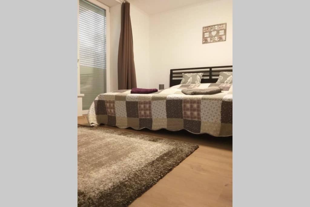 Posteľ alebo postele v izbe v ubytovaní Tölgyerdő Apartman