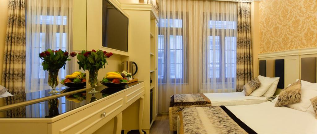 a hotel room with a bed and a window at Best Nobel Hotel in Istanbul
