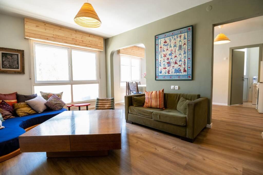 a living room with a couch and a table at Desert Zen in Mitzpe Ramon