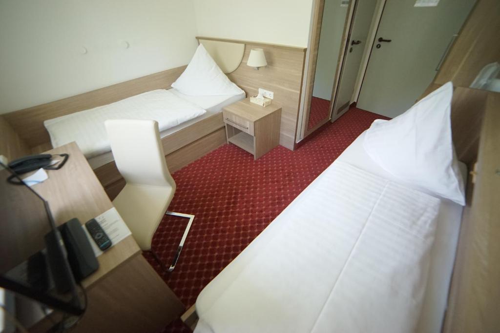 Postel nebo postele na pokoji v ubytování Aparthotel Wangener Landhaus
