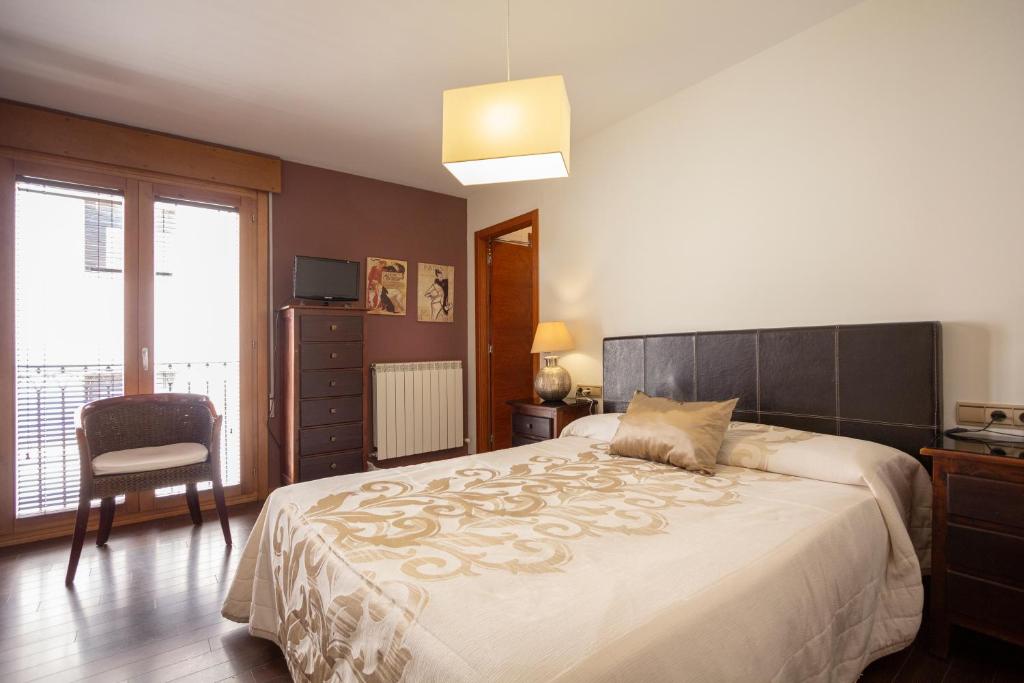 Postel nebo postele na pokoji v ubytování Hostal Los Canteros