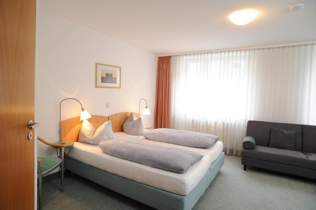 Postel nebo postele na pokoji v ubytování Central-Classic Hotel