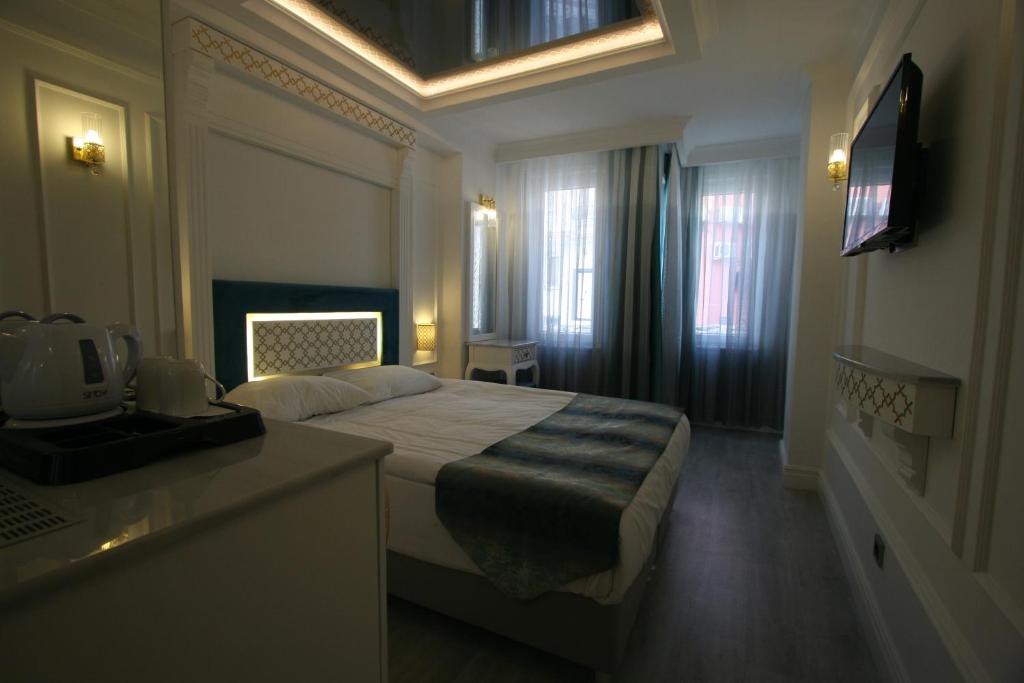 Een bed of bedden in een kamer bij Ligos