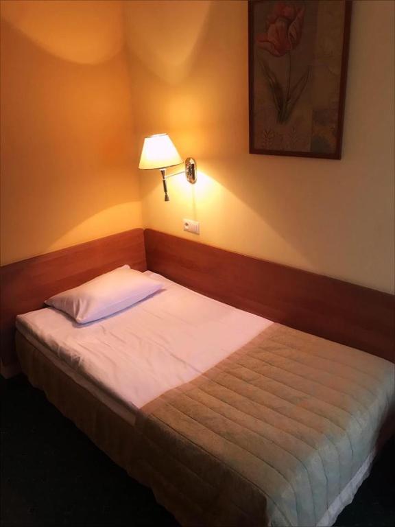 Postel nebo postele na pokoji v ubytování Hotel U Witaszka
