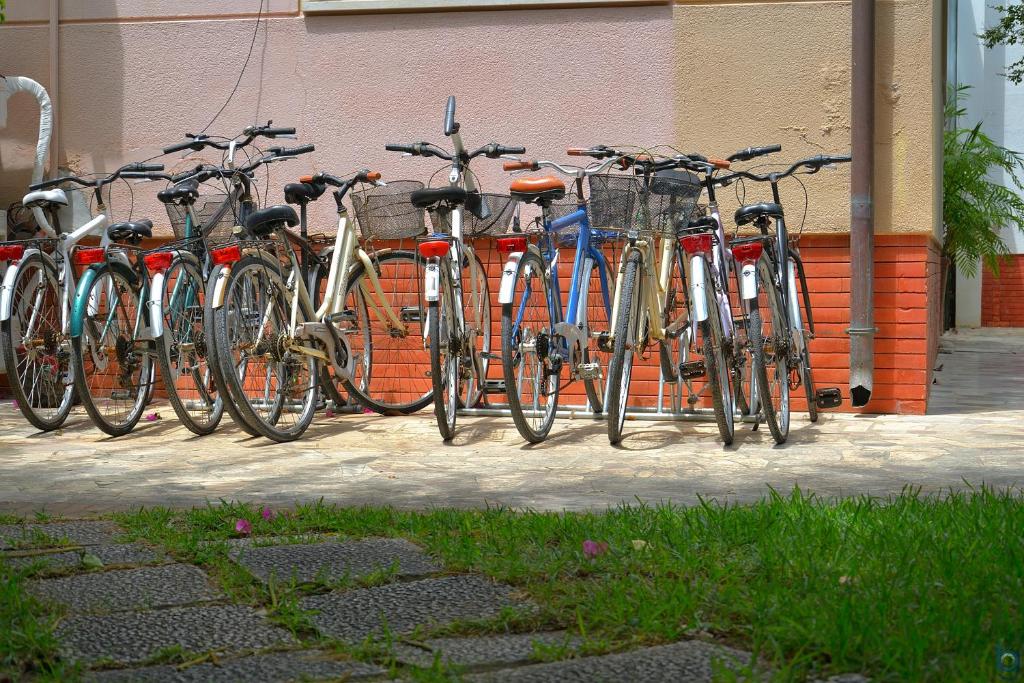 a row of bikes parked in front of a building at B&b Mondello Resort in Palermo
