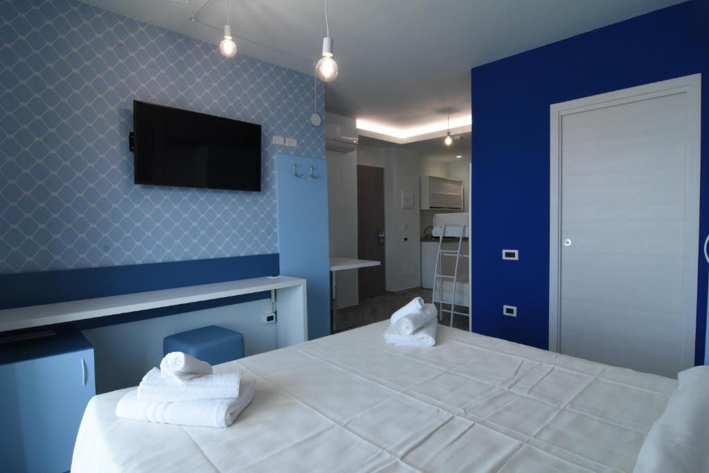 Posteľ alebo postele v izbe v ubytovaní Hotel Calypso